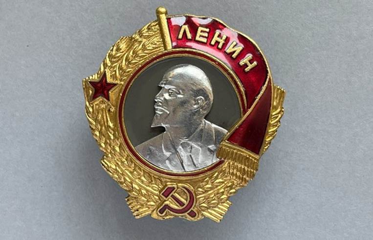 A gold and red badge with a person in the middle

AI-generated content may be incorrect.
