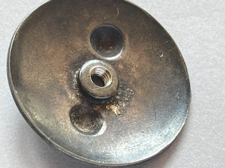 A close-up of a metal object

AI-generated content may be incorrect.