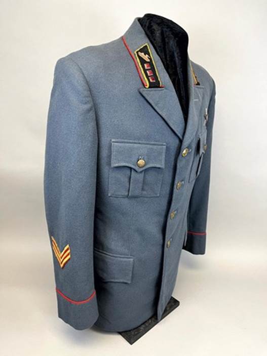 A blue military uniform with patches

AI-generated content may be incorrect.