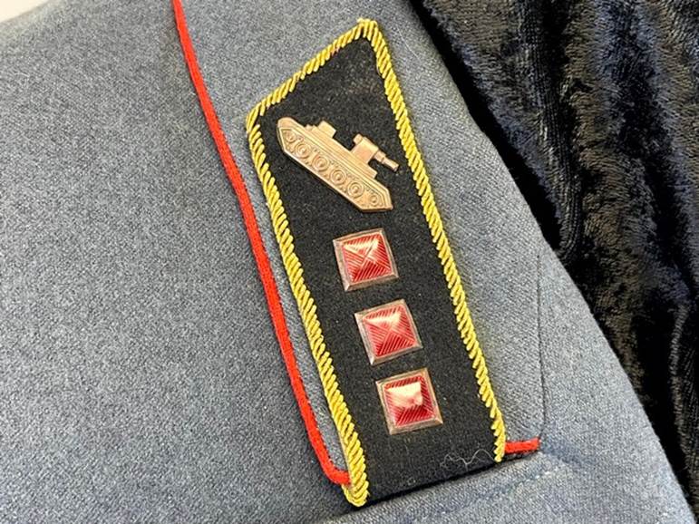 A close up of a military uniform

AI-generated content may be incorrect.