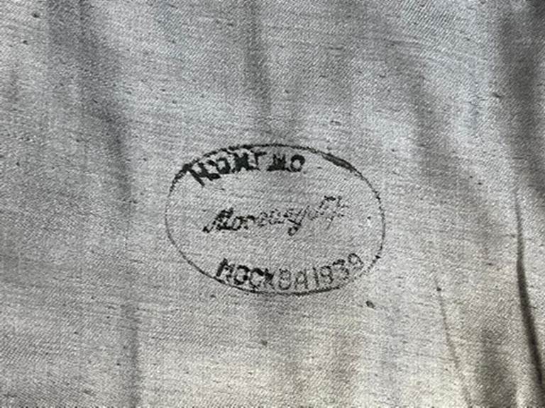 A close-up of a stamp

AI-generated content may be incorrect.