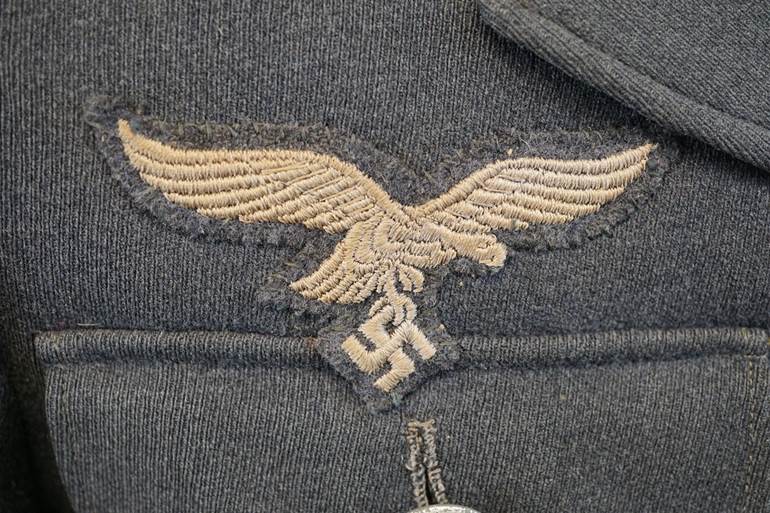 A close up of a military uniform

AI-generated content may be incorrect.