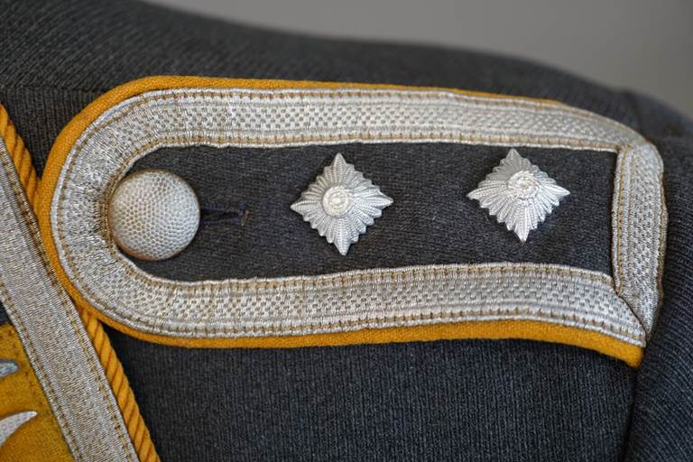 A close-up of a military uniform

AI-generated content may be incorrect.