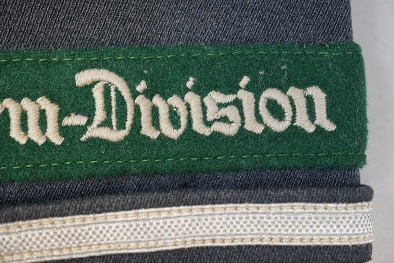 A green and white label on a grey fabric

AI-generated content may be incorrect.