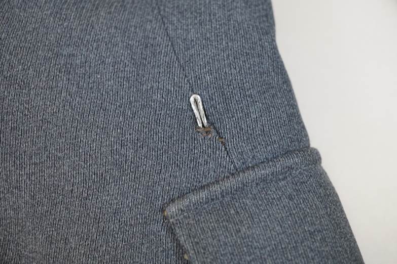A close-up of a button on a piece of fabric

AI-generated content may be incorrect.