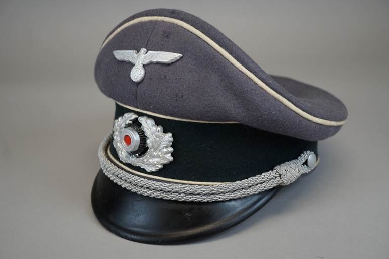 A black hat with silver accents

AI-generated content may be incorrect.