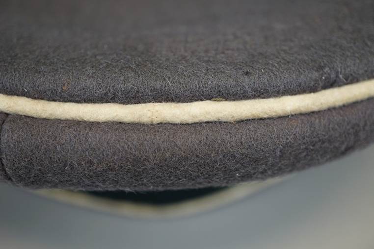 A close-up of a hat

AI-generated content may be incorrect.
