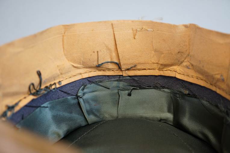 A close-up of a hat

AI-generated content may be incorrect.