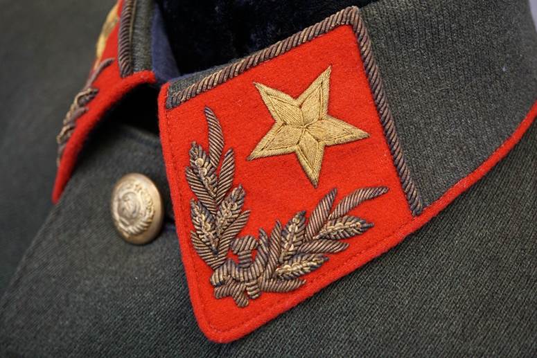 A close-up of a red patch

AI-generated content may be incorrect.