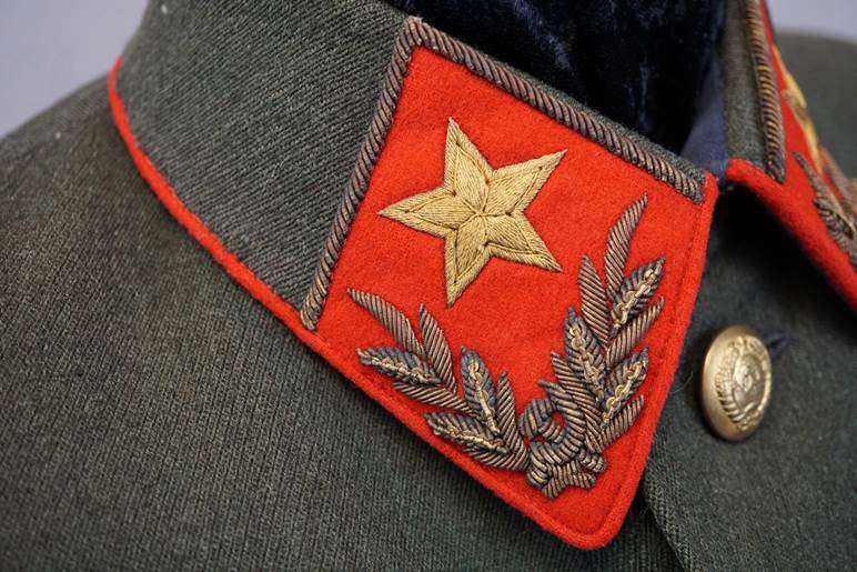 A close-up of a red patch

AI-generated content may be incorrect.