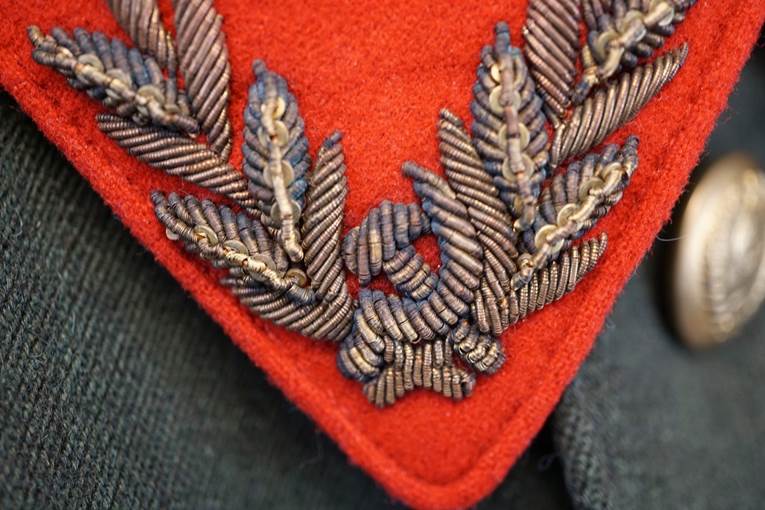 A close-up of a red patch

AI-generated content may be incorrect.