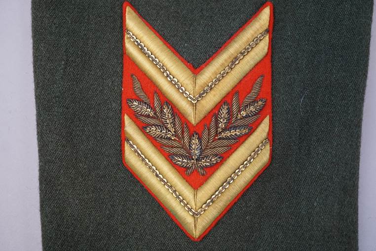 A close-up of a red and gold chevron

AI-generated content may be incorrect.