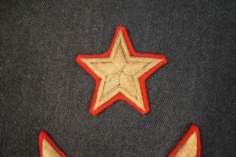 A close-up of a star patch

AI-generated content may be incorrect.