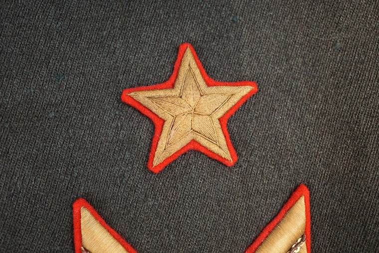 A close-up of a star patch

AI-generated content may be incorrect.