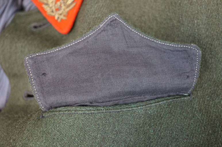 A close-up of a military uniform

AI-generated content may be incorrect.