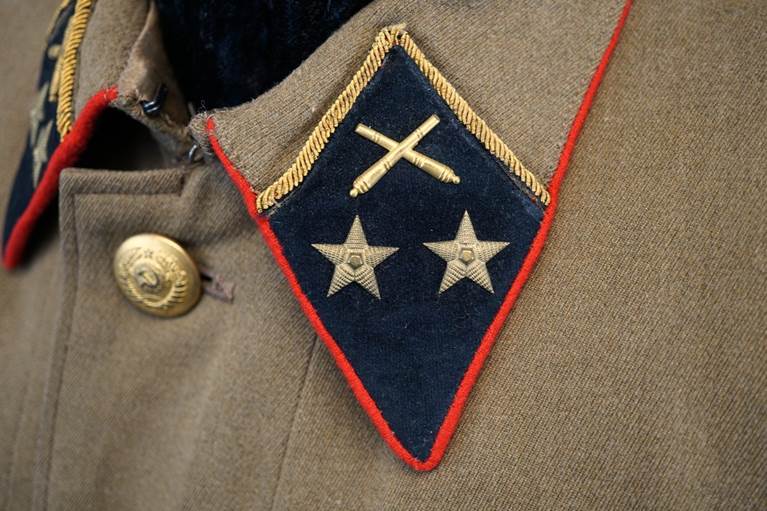 A close-up of a military uniform

AI-generated content may be incorrect.