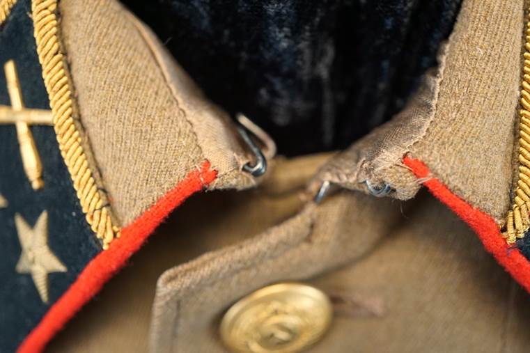 Close-up of a military uniform

AI-generated content may be incorrect.