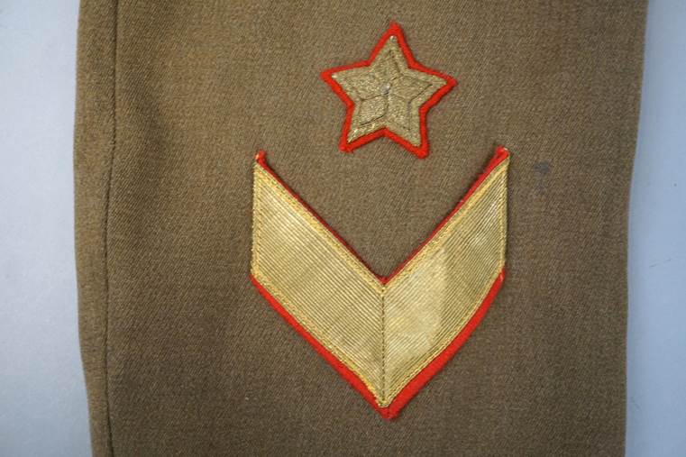 A close-up of a military uniform

AI-generated content may be incorrect.