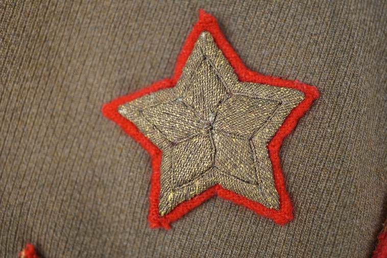 A star embroidered on a fabric surface

AI-generated content may be incorrect.