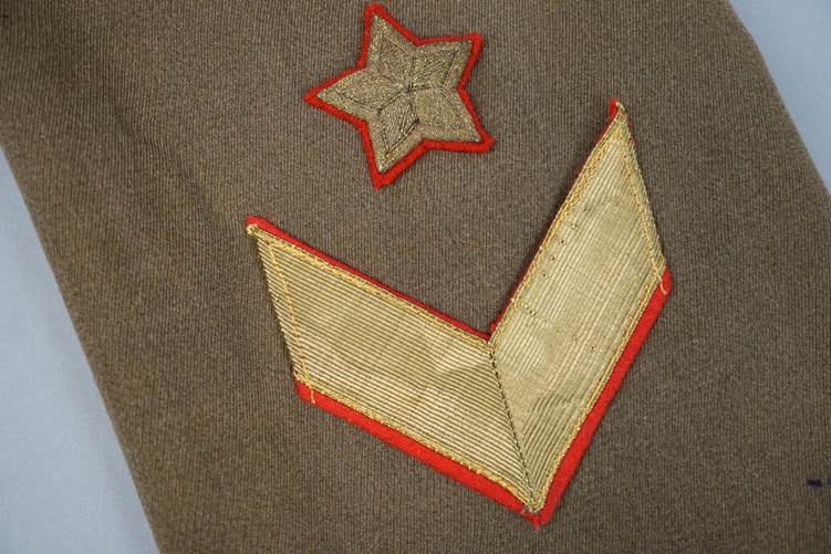 A close-up of a military uniform

AI-generated content may be incorrect.