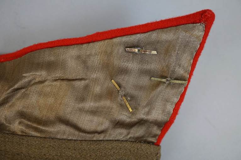 A close-up of a red and brown cloth

AI-generated content may be incorrect.