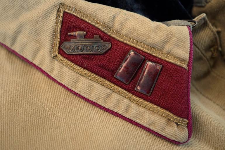 A close-up of a military uniform

AI-generated content may be incorrect.