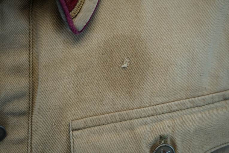 A stain on a jacket

AI-generated content may be incorrect.