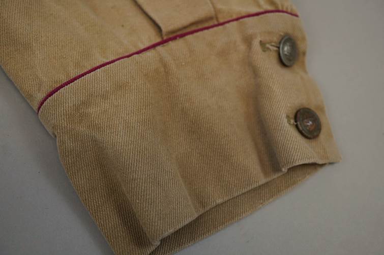Close-up of a brown shirt sleeve

AI-generated content may be incorrect.