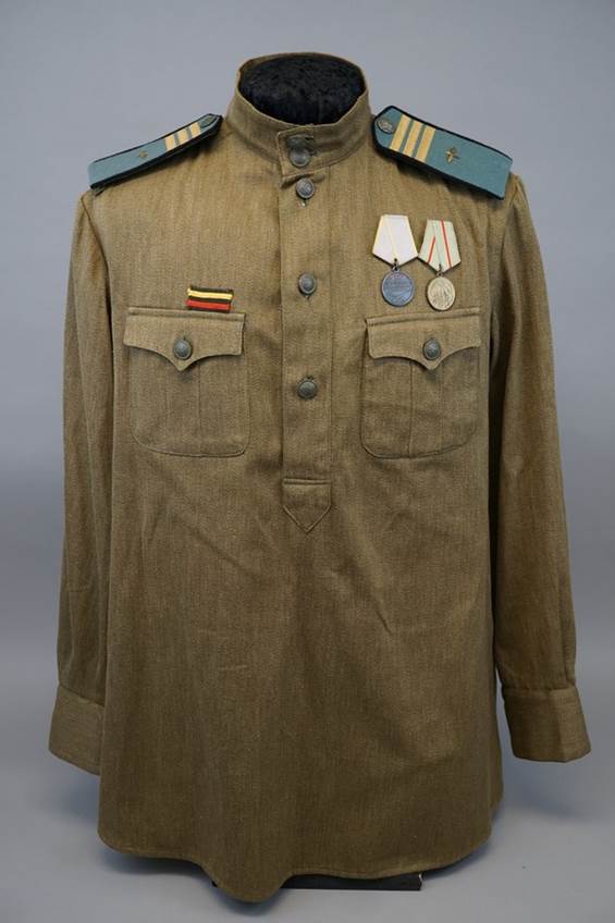 A military uniform with medals on the shoulder

AI-generated content may be incorrect.
