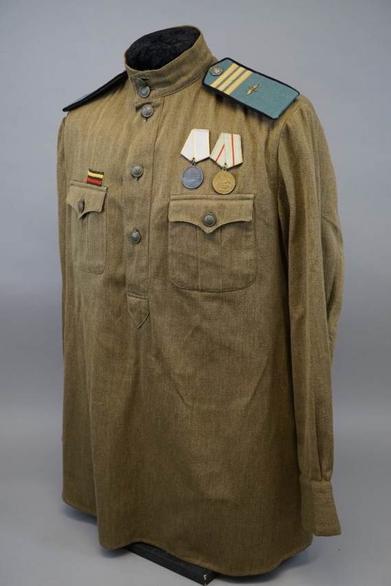 A military uniform with medals on the chest

AI-generated content may be incorrect.