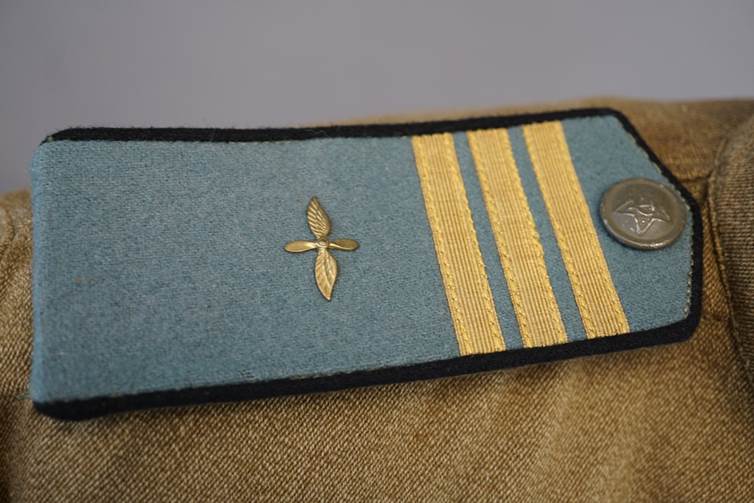 A close-up of a blue and gold uniform

AI-generated content may be incorrect.