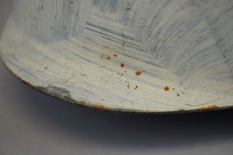 A close-up of a metal surface

AI-generated content may be incorrect.