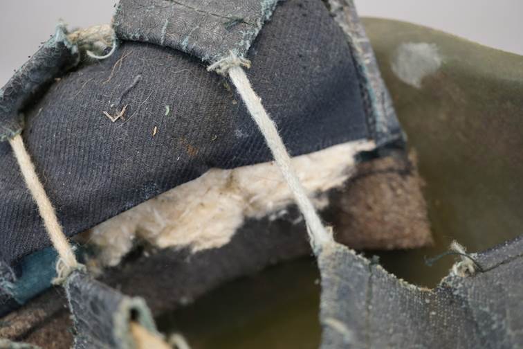 A close-up of a dirty shoe

AI-generated content may be incorrect.