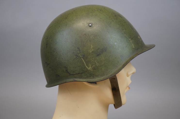 A helmet on a mannequin head

AI-generated content may be incorrect.