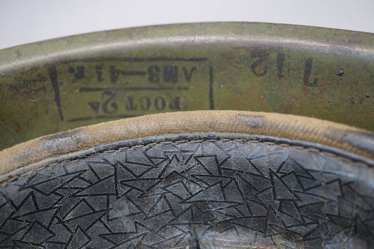 A close-up of a military helmet

AI-generated content may be incorrect.