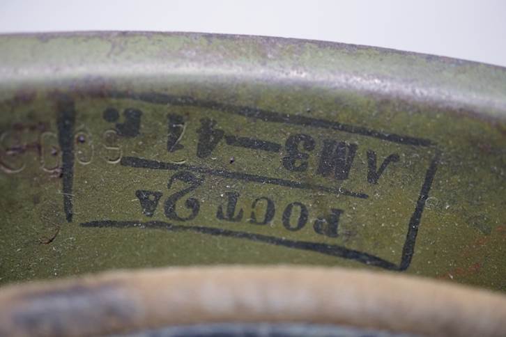 A close-up of a green metal container

AI-generated content may be incorrect.