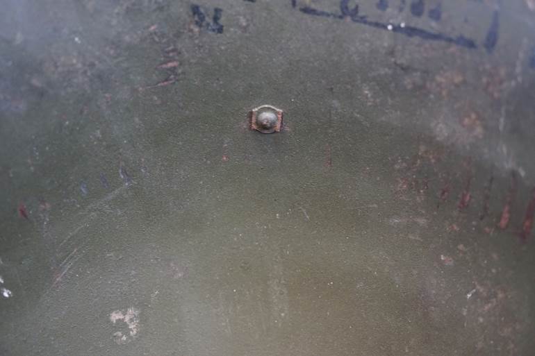 A close-up of a metal surface

AI-generated content may be incorrect.