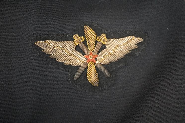 A close-up of a embroidered emblem

AI-generated content may be incorrect.