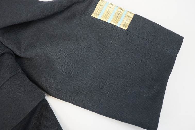 A close-up of a black tie

AI-generated content may be incorrect.