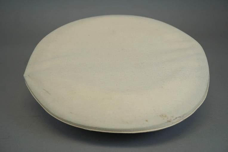 A white round object with a white surface

AI-generated content may be incorrect.