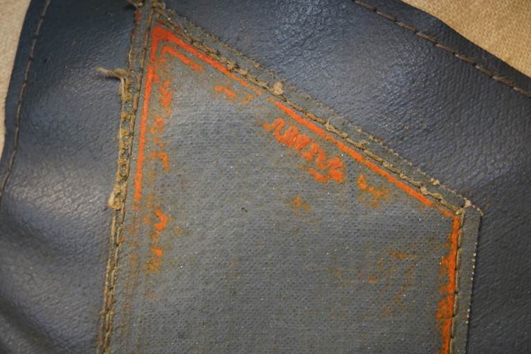 A close-up of a piece of leather

AI-generated content may be incorrect.