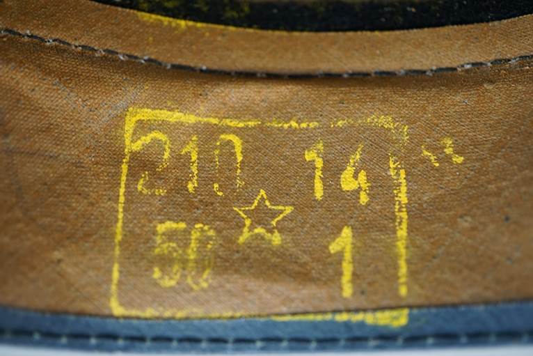 A close-up of a leather cap

AI-generated content may be incorrect.