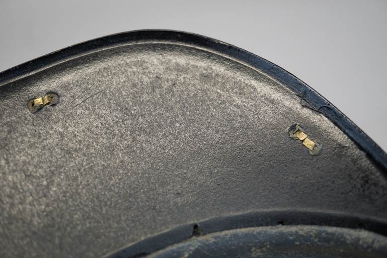 A close-up of a metal surface

AI-generated content may be incorrect.