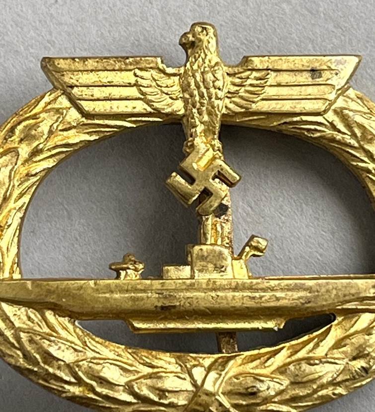 A gold object with a symbol on it

AI-generated content may be incorrect.