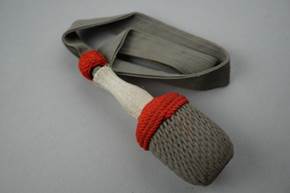 A grey and red rope with a white handle

Description automatically generated
