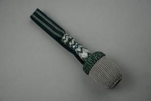 A close-up of a microphone

Description automatically generated