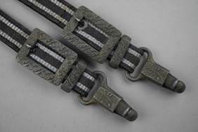 A close-up of a pair of belts

Description automatically generated