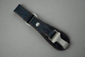A leather strap with a silver buckle

Description automatically generated