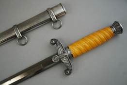 A picture containing weapon, indoor, knife, sword

Description automatically generated