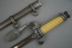 A close-up of a dagger

Description automatically generated